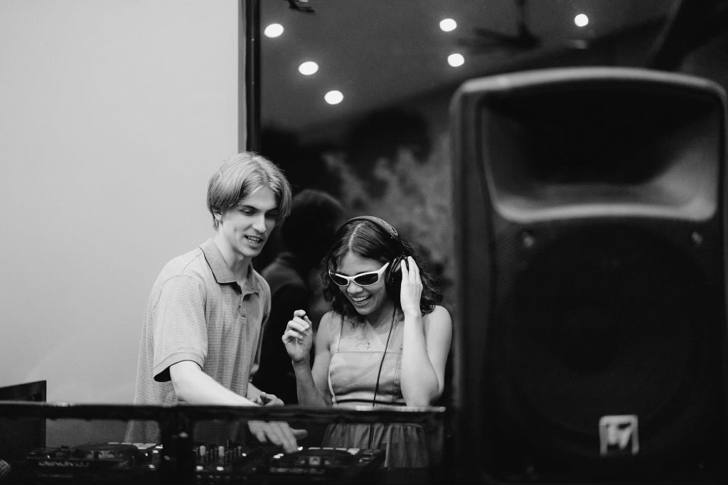 DJ Coop sharing the booth